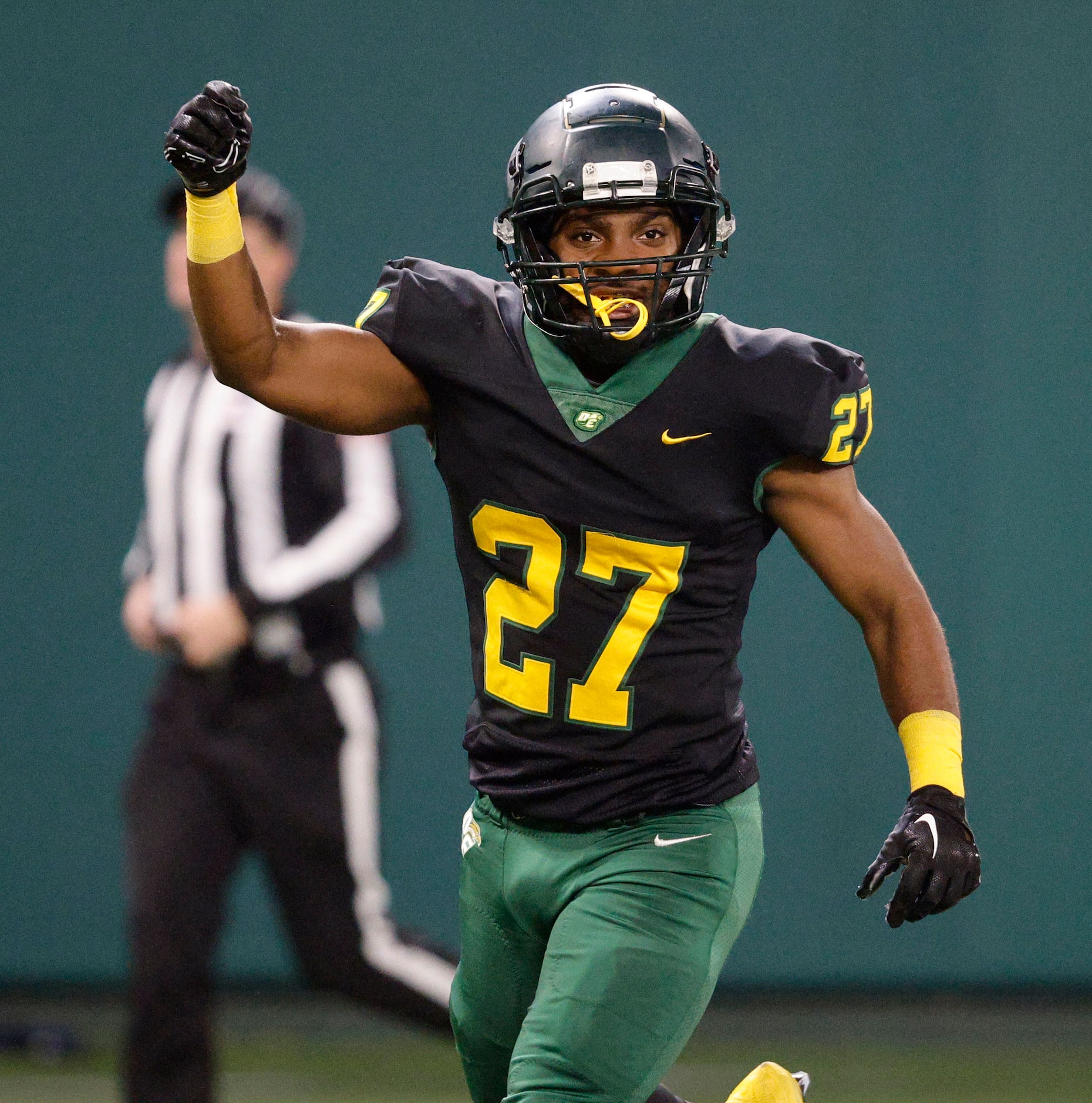 DeSoto's Marvin Duffey (27) cerebrates after scoring a touchdown during the first half of a...