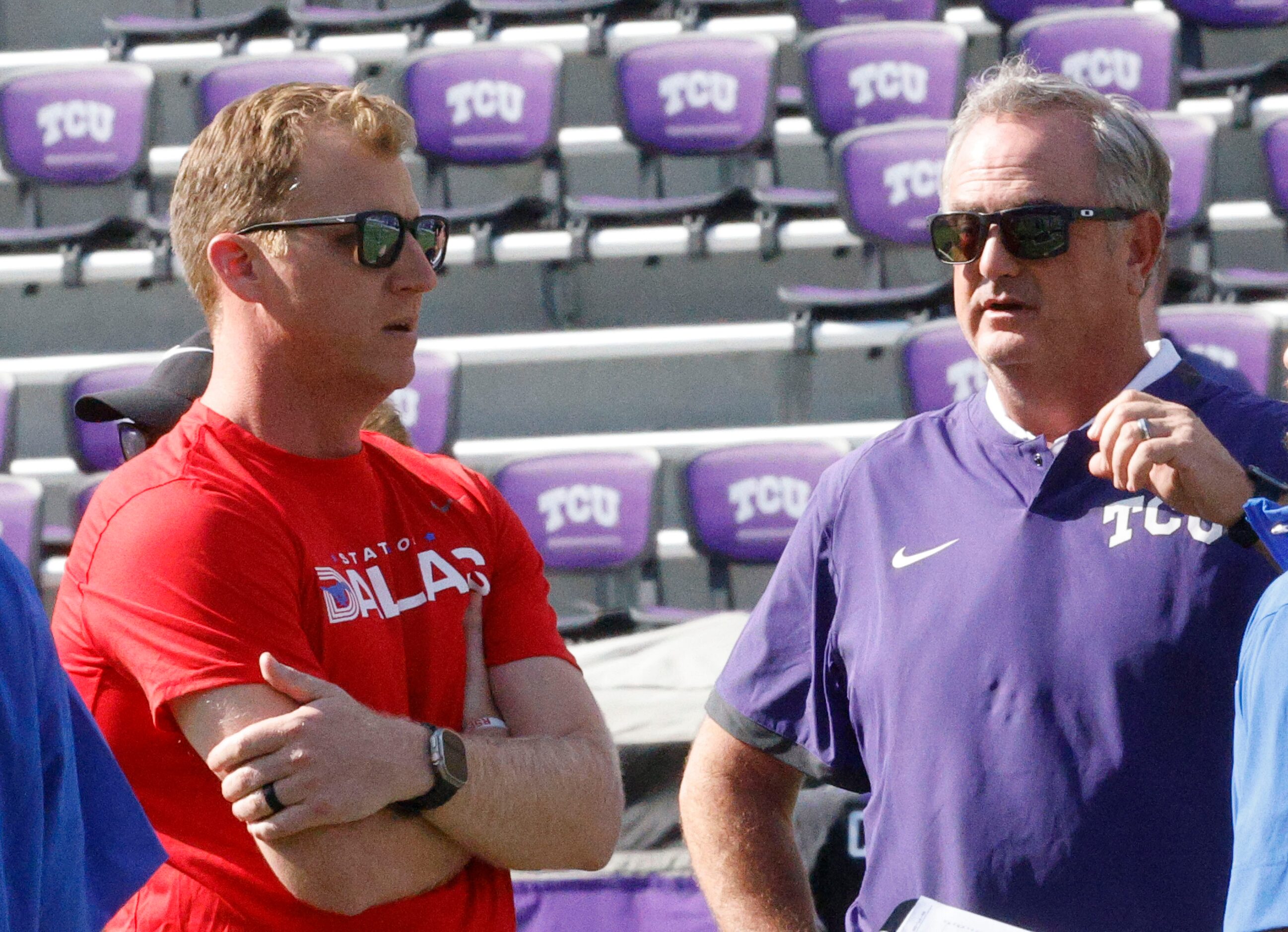 Southern Methodist Mustangs head coach Rhett Lashlee, left, talks with TCU Horned Frogs head...