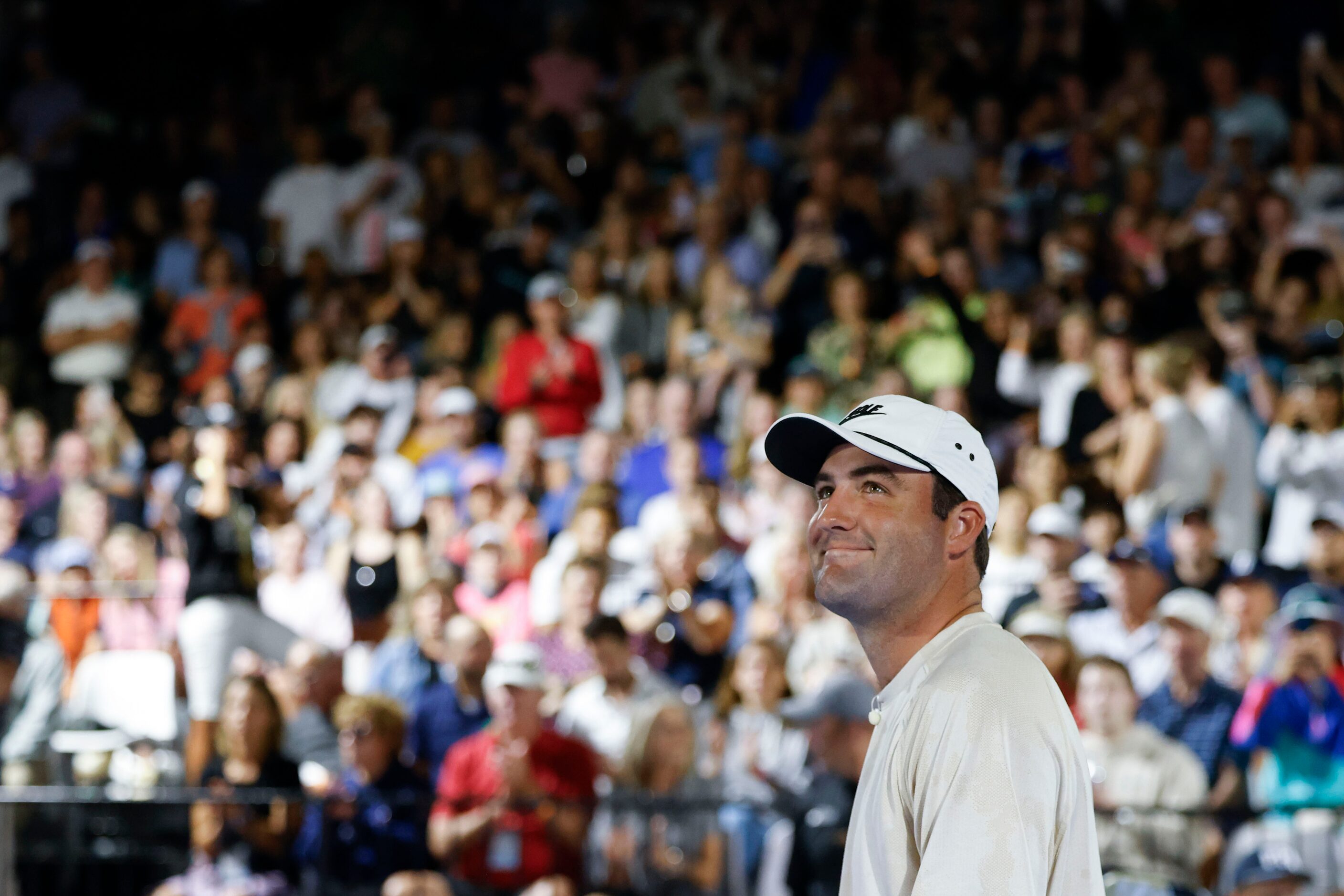 Pro golfer Scottie Scheffler reacts towards crowd during Celebrity Pickleball Showdown on...