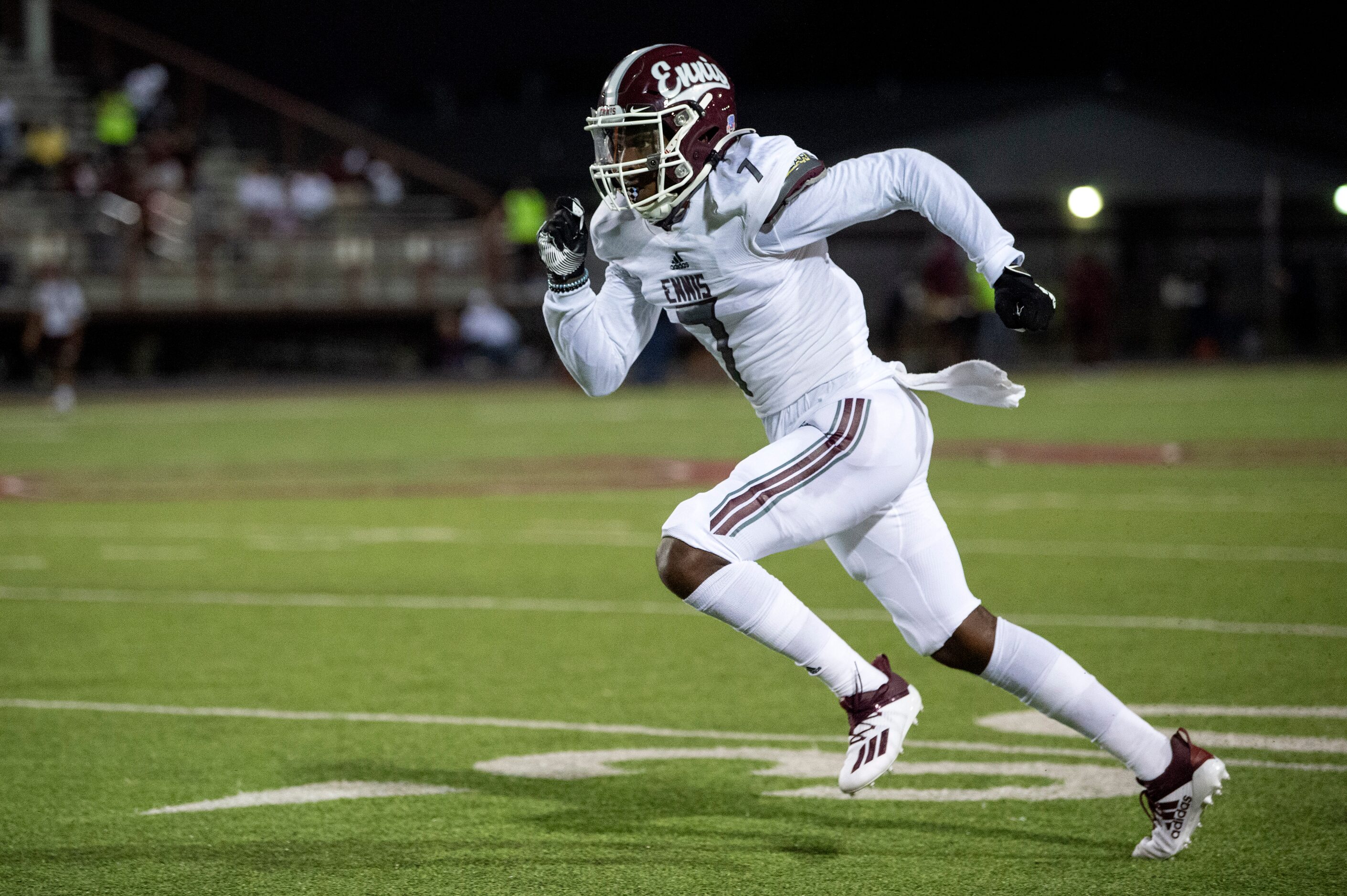 Ennis senior wide receiver Laylon Spencer (7) runs upfield during the first half of a high...