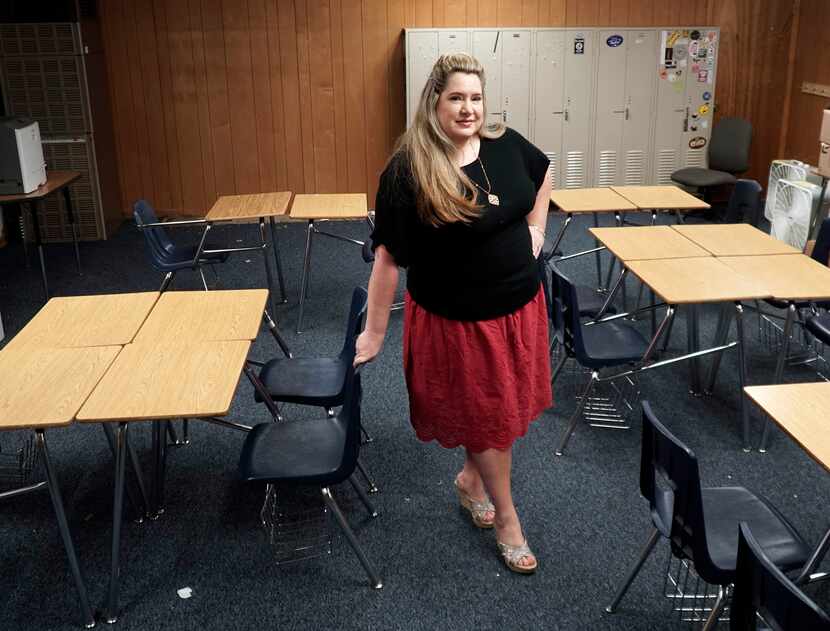 Kimberly Fabela-Lopez, who teaches at Fort Worth ISD's International Newcomer Academy, helps...