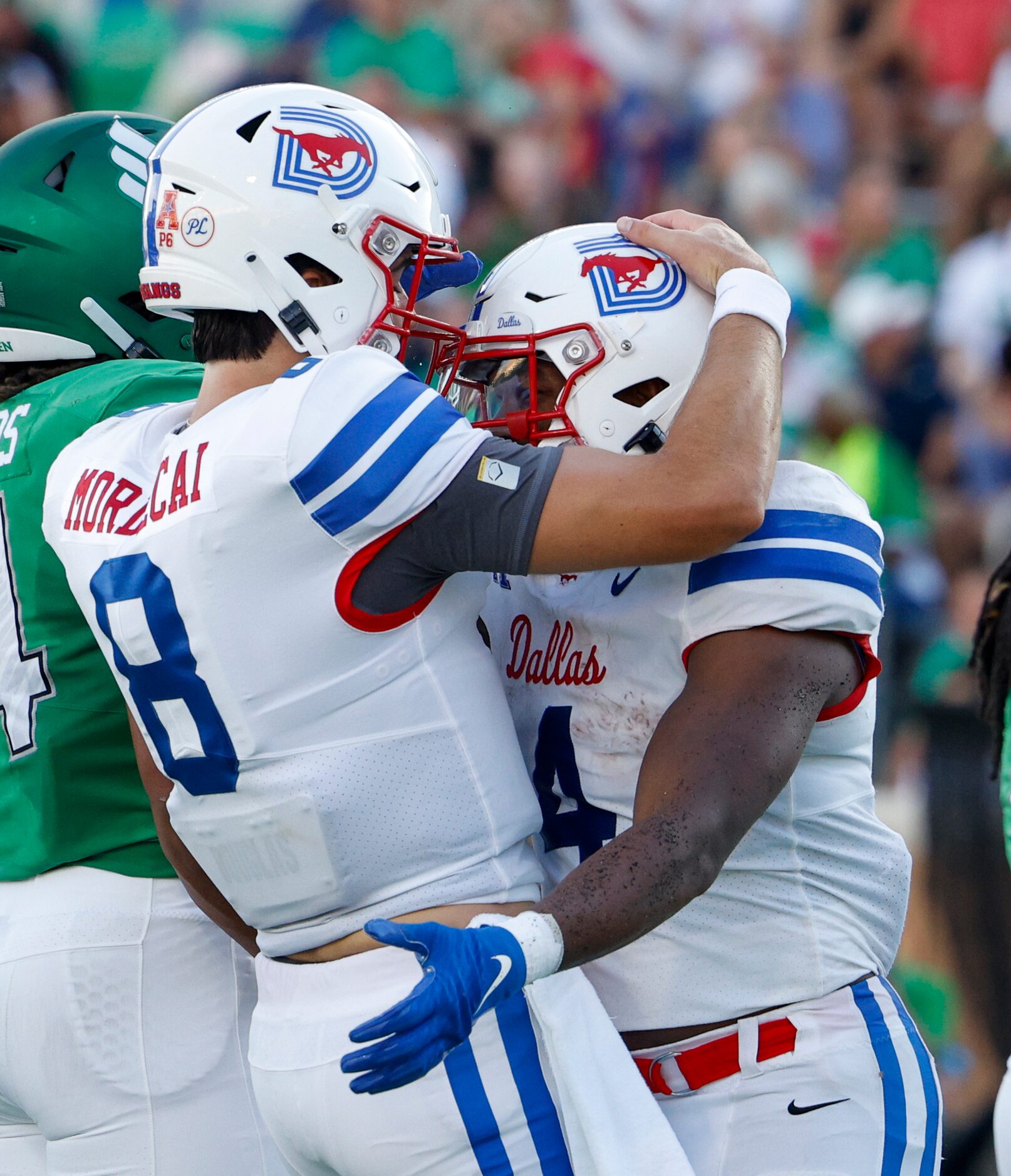 SMU quarterback Tanner Mordecai (8) celebrates running back Tre Siggers (4) touchdown during...