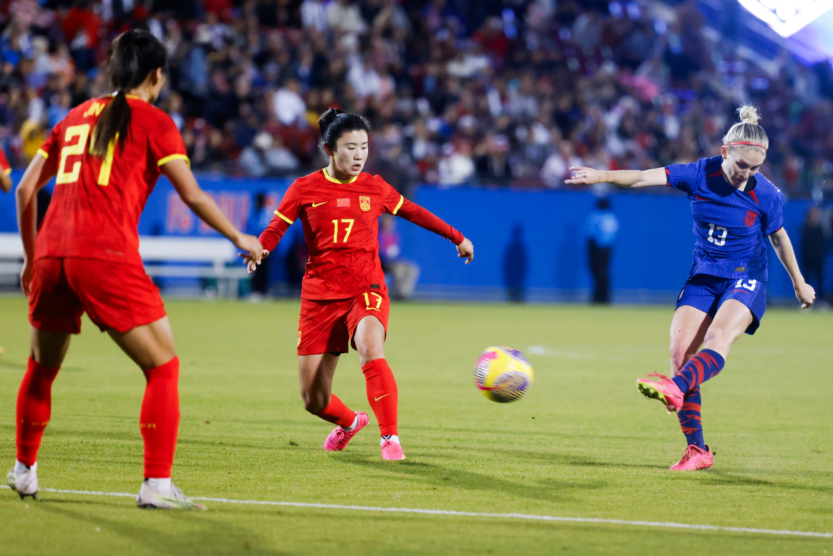 China’s Jin Kun (left) and Yan Jinjin (center) watch as United States’ Jenna Nighswonger...