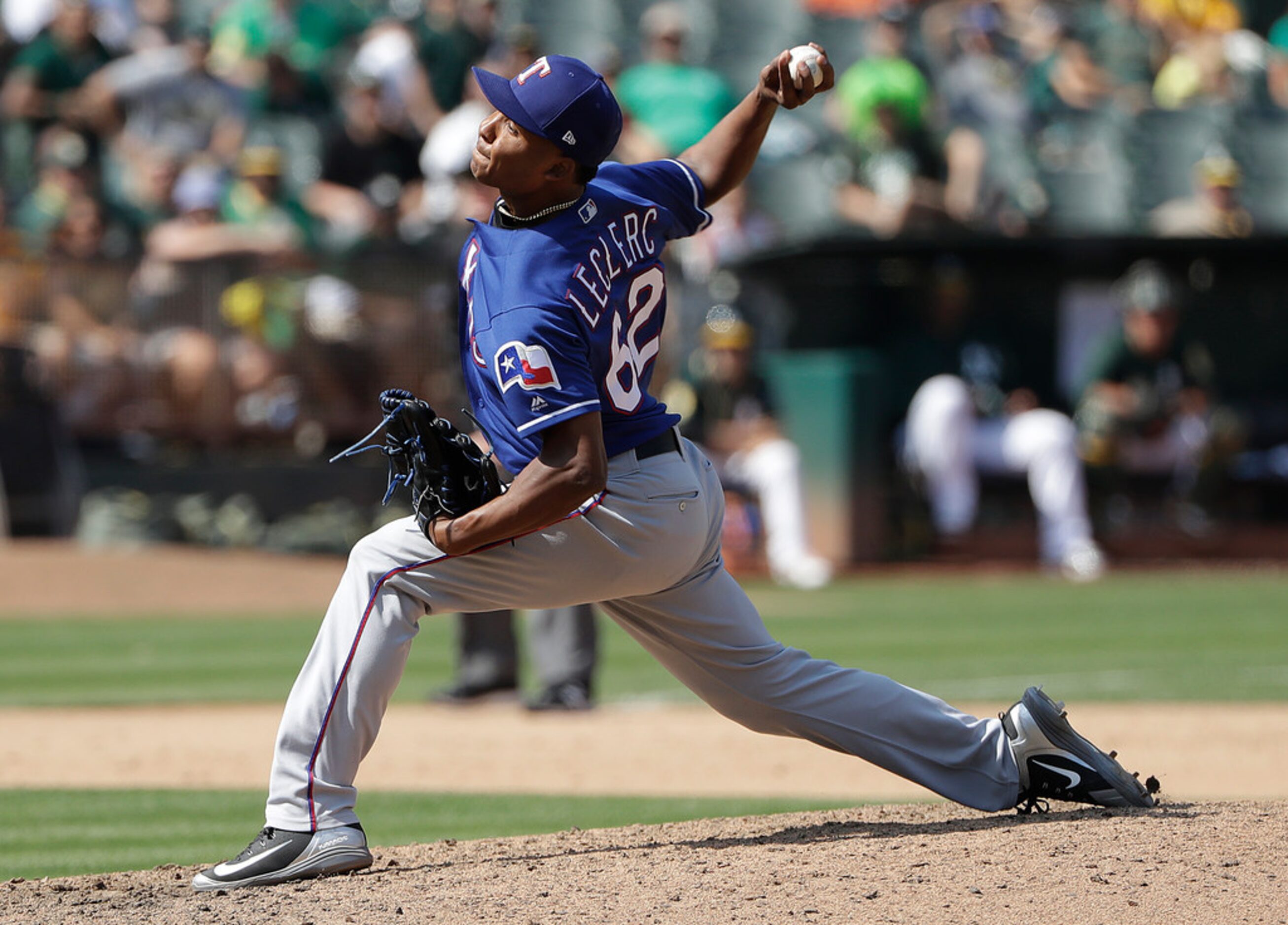 Texas Rangers pitcher Jose Leclerc (62) throws against the Oakland Athletics during the...