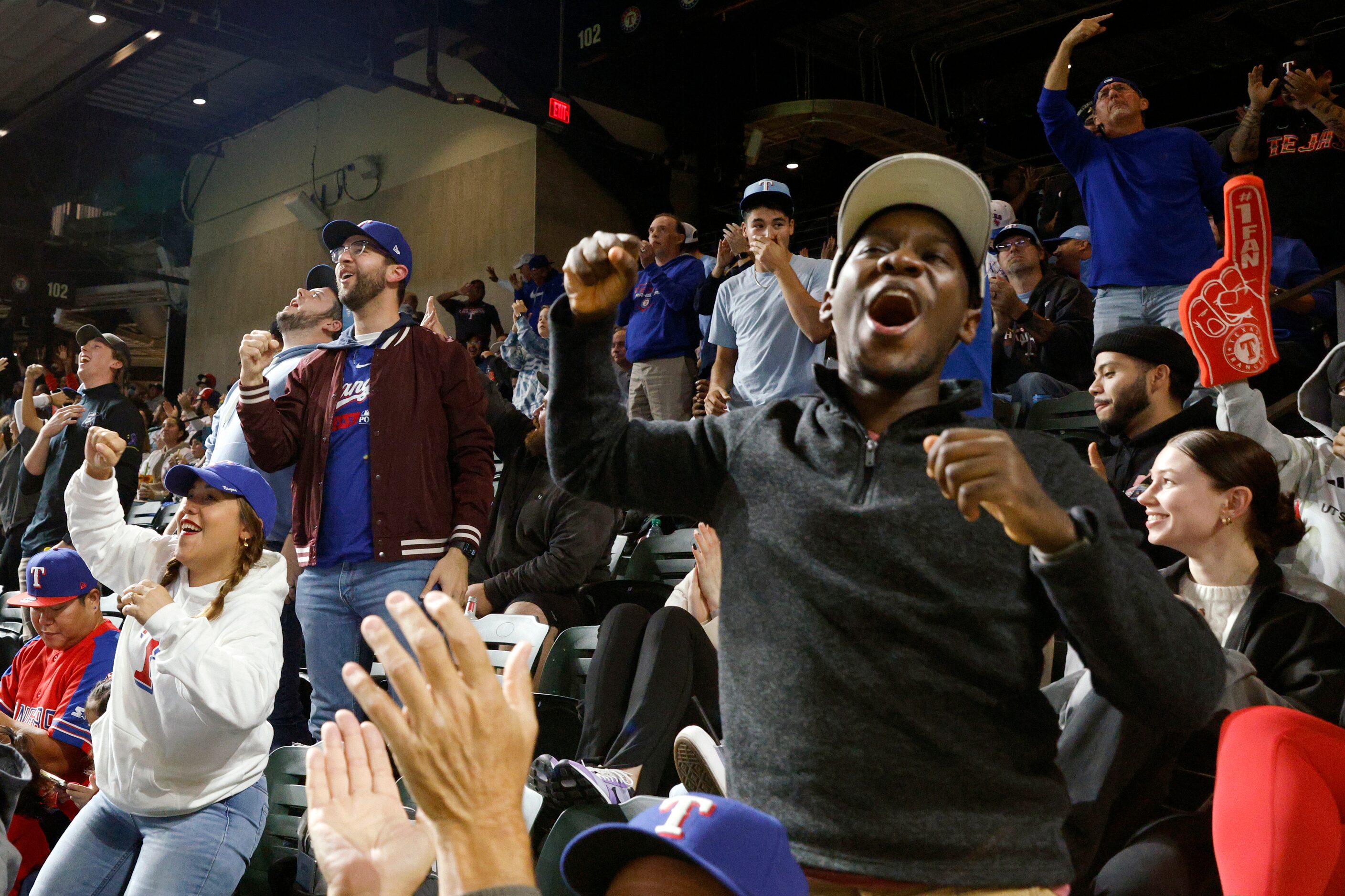 Fans celebrate after the Texas Rangers won Game 3 of the World Series against the Arizona...