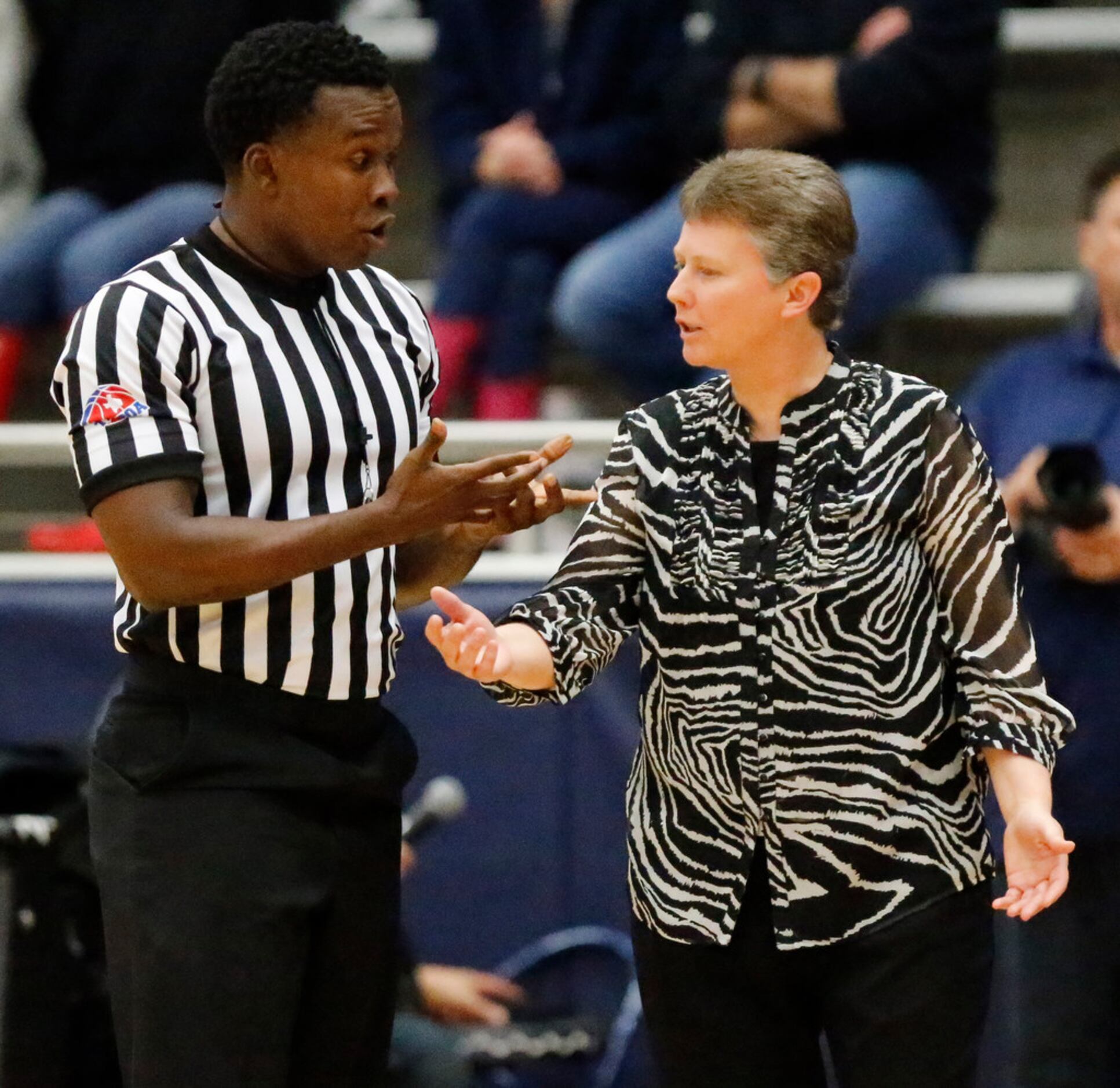 Flower Mound High School head coach Sherika Nelson (right) gets an explanation during a time...