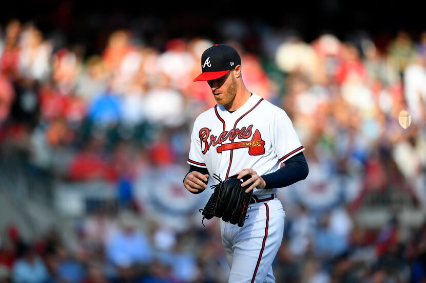 Atlanta Braves starting pitcher Mike Foltynewicz is relieved during the first inning of Game...