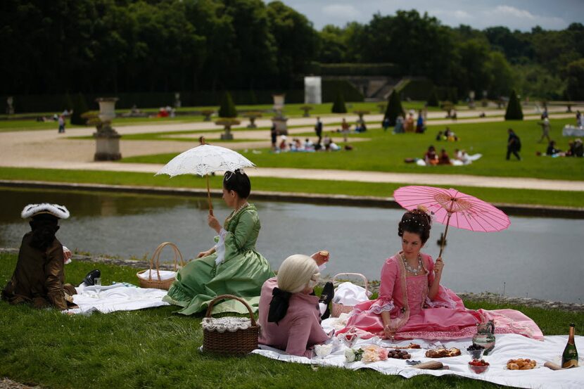 By the time these Paris parasol-carriers changed from their multi-layered period costumes...