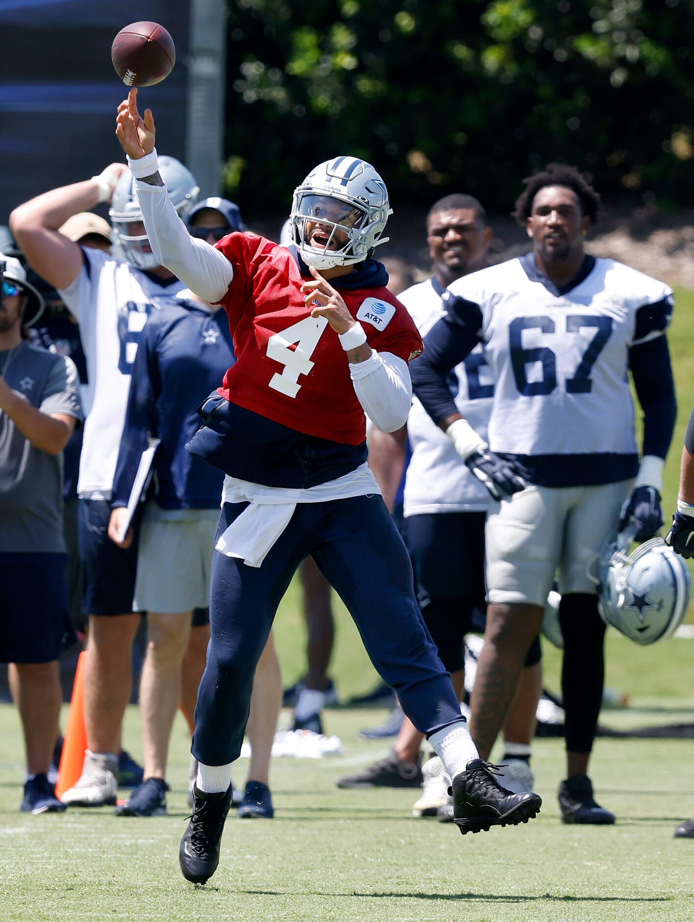 Dallas Cowboys quarterback Dak Prescott (4) throws on the run during a Training Camp...