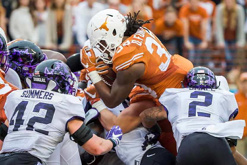 Texas running back D'Onta Foreman (33) is stopped short of the end zone on a 4th-and-goal...