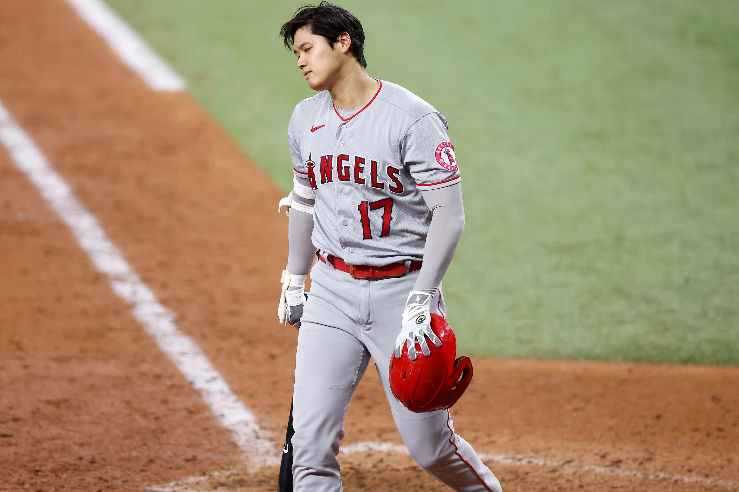 Los Angeles Angels designated hitter Shohei Ohtani (17) reacts after Texas Rangers relief...