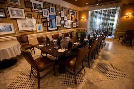 The restored wood table in The Landmark Prime Rib's private dining room is estimated to be...