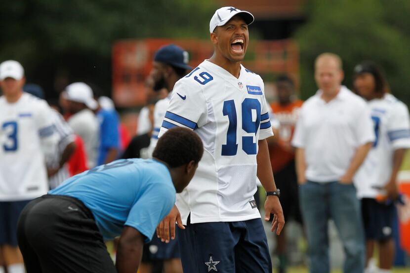 Miles Austin yells to players during Cowboys camp for the first annual 'DALLAS COWBOYS U'...