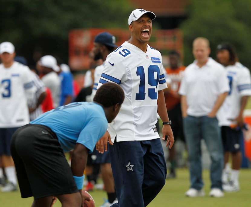 Miles Austin yells to players during Cowboys camp for the first annual 'DALLAS COWBOYS U'...