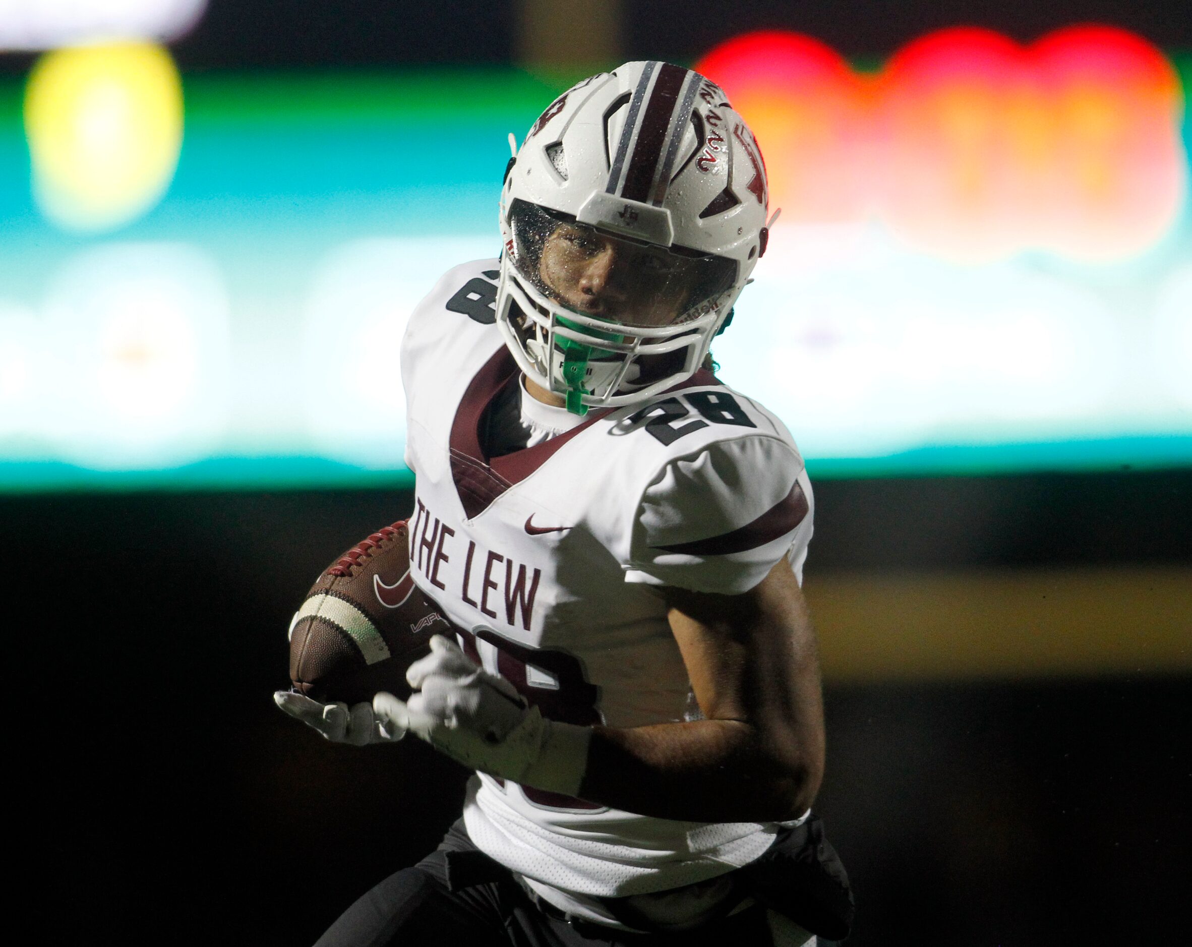 Lewisville running back Tenel Hill (28) eyes the end zone enroute to a 20-yard touchdown run...