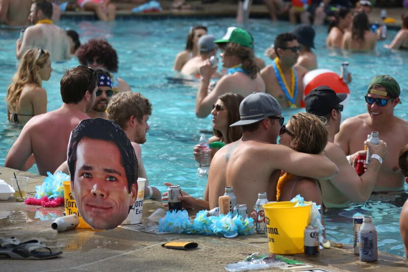 A large cutout photo of The Ticket's Corby Davidson stands watch poolside during The...