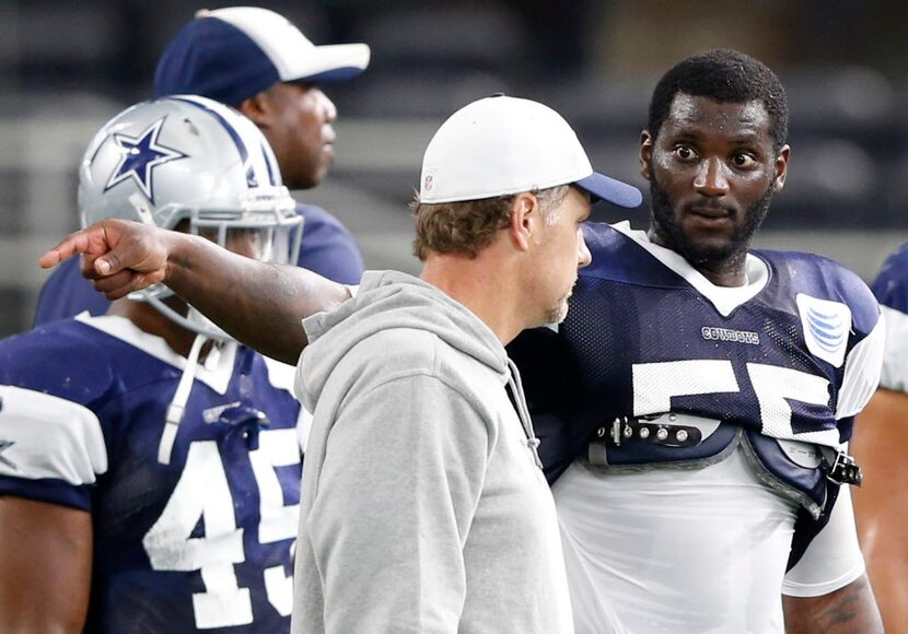 Dallas Cowboys middle linebacker Rolando McClain (55) talks with Dallas Cowboys linebackers...