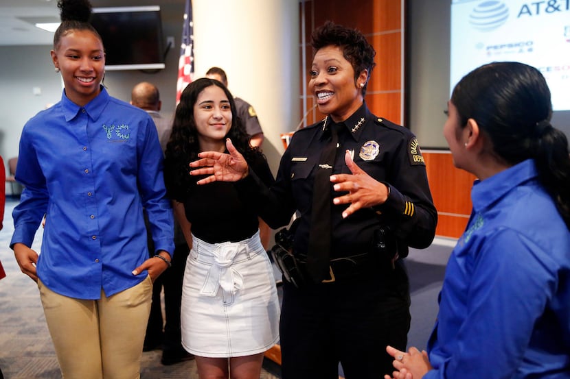 Dallas Police Chief U. Renee Hall visits with Youth Commission representatives (from left)...