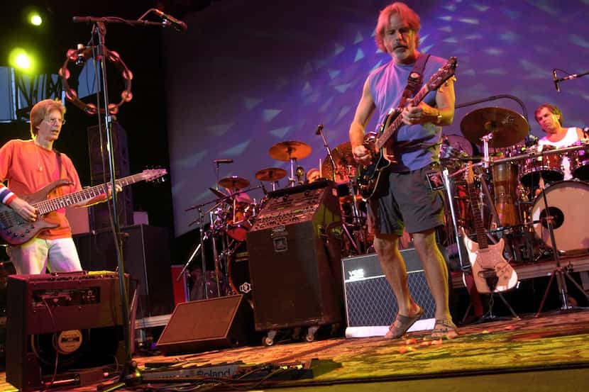 From left, Phil Lesh, Bill Kreutzmann (partially obscured), Bob Weir and Mickey Hart perform...
