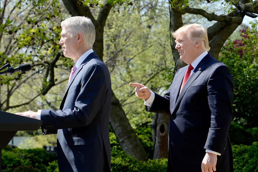 Now Associate Justice of the Supreme Court Neil Gorsuch speaks as President Donald Trump...