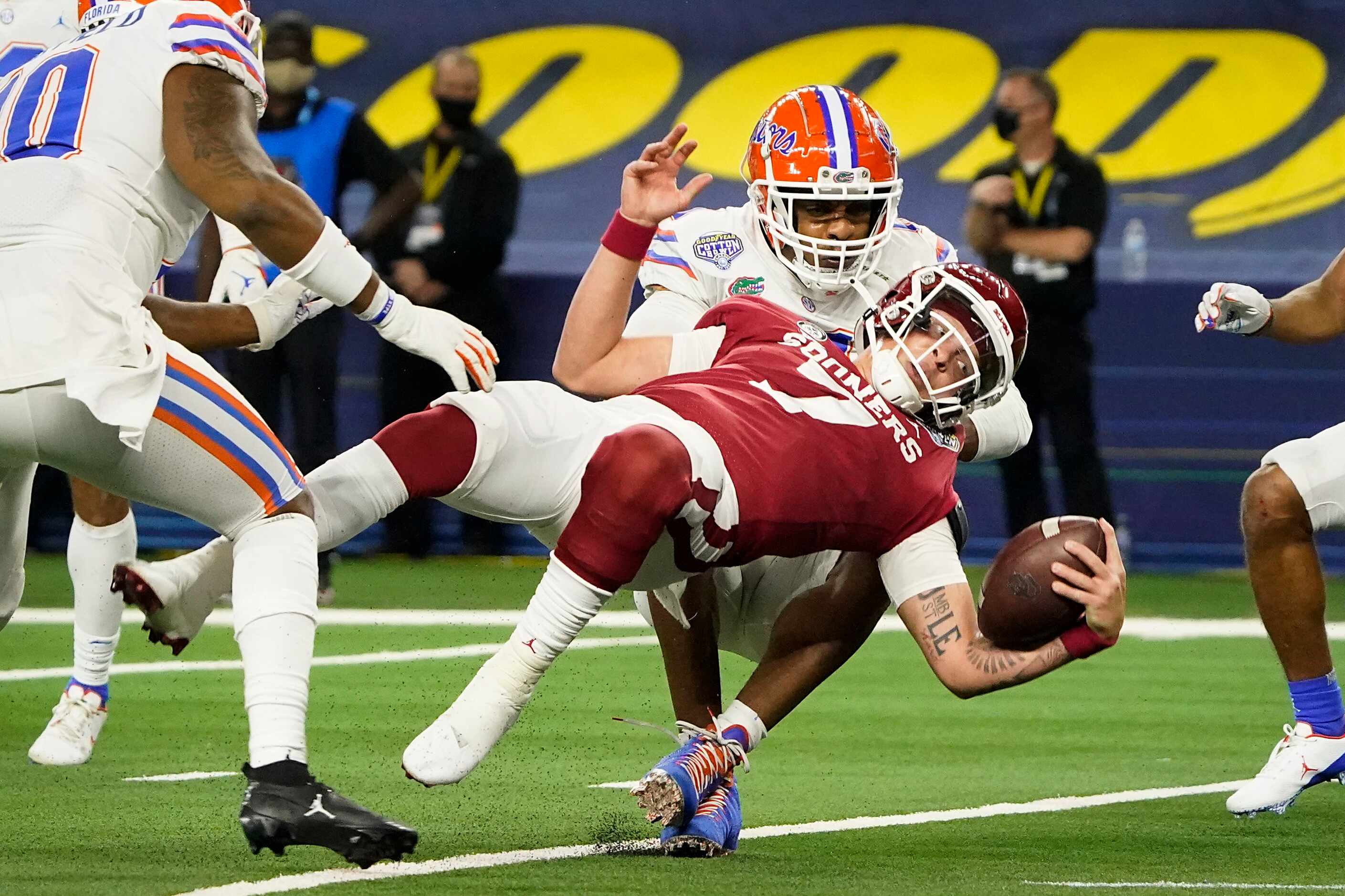 Oklahoma quarterback Spencer Rattler (7) twists into the end zone on a touchdown run \past...