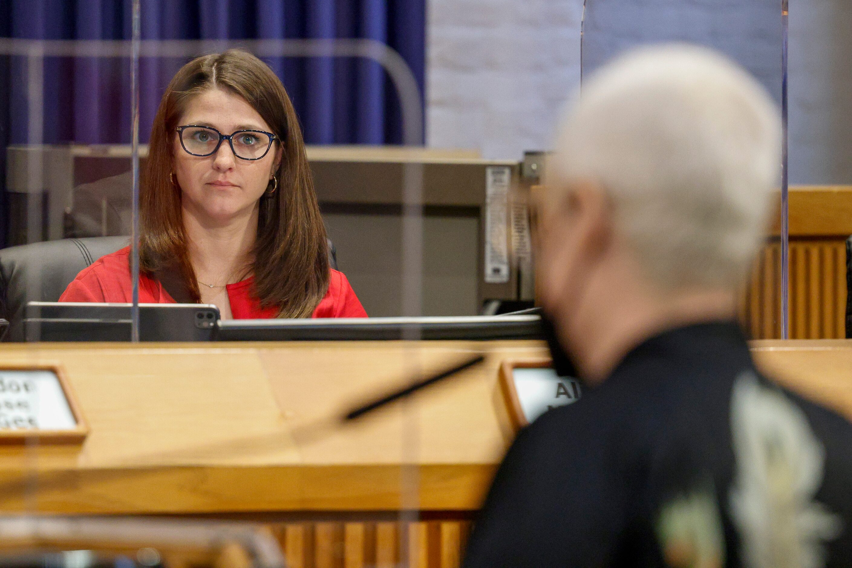 Denton City Council member Alison Maguire listens to public comment about a resolution to...