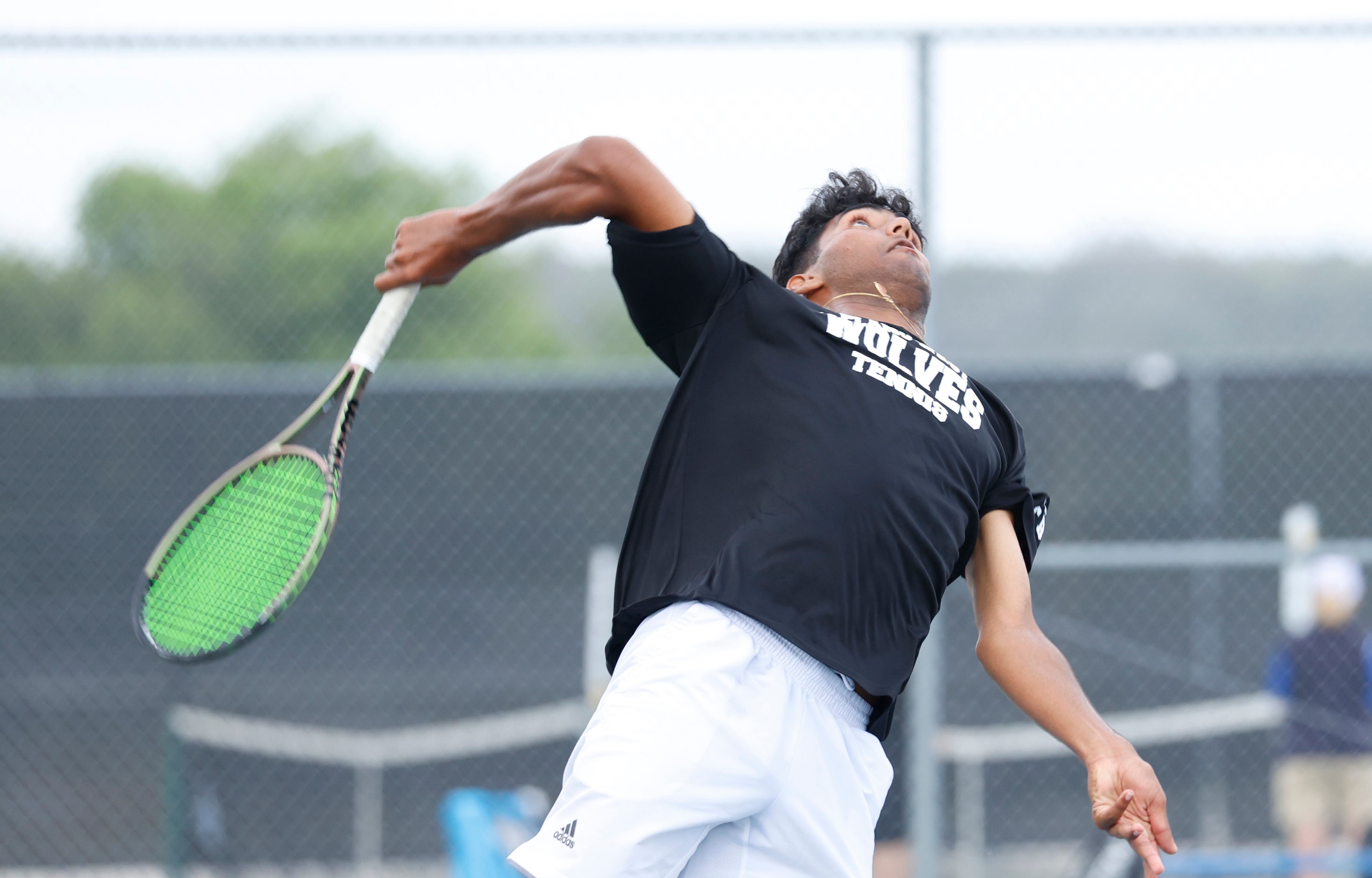 In Class 6A boys doubles Allen’s Tejas Ram serves against Woodlands’ Jose Perez and Emilio...