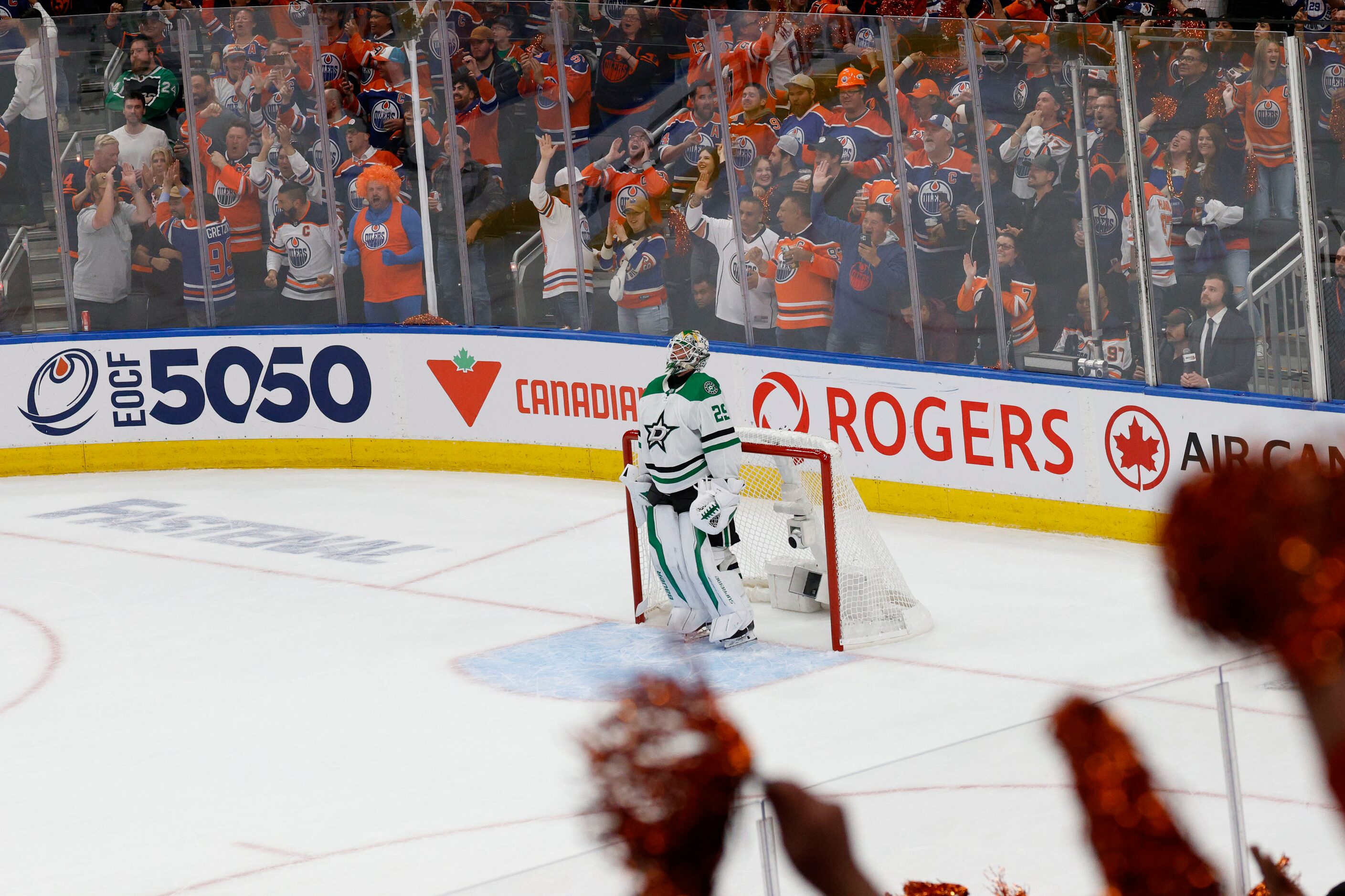 Dallas Stars goaltender Jake Oettinger (29) looks up as fans celebrate after Edmonton Oilers...