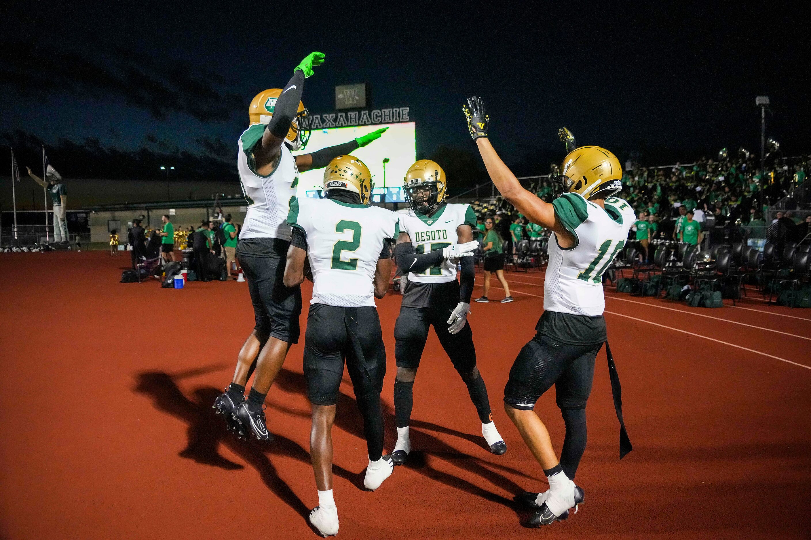 DeSoto  defensive back Sael Reyes (17) celebrates with teammates Makali McKellar (10), Mario...