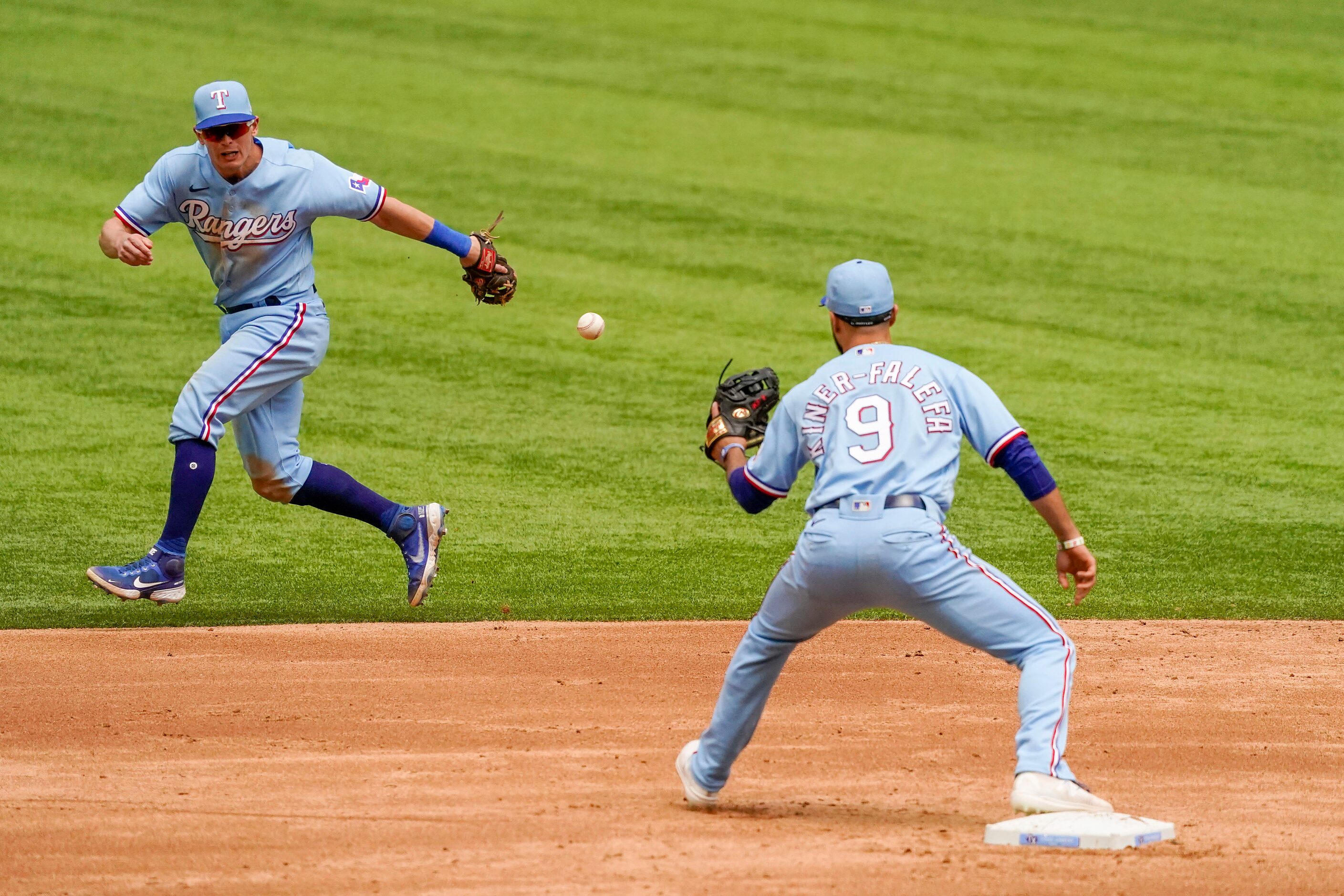 Texas Rangers second baseman Nick Solak makes a throw to shortstop Isiah Kiner-Falefa the on...