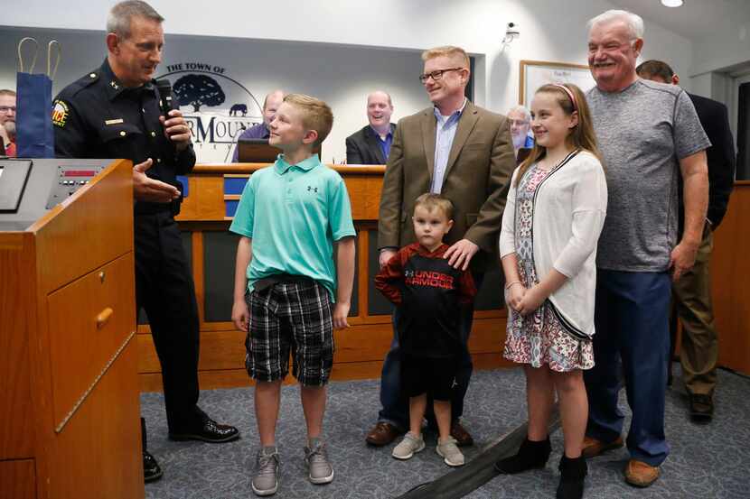 Eleven-year-old Blake Leonard of Argyle is recognized by Flower Mound Police Chief Andy...