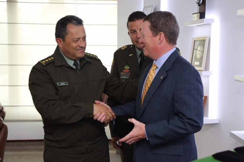 U.S. Attorney Joe Brown is greeted by General Jorge Hernando Nieto Rojas of the Colombian...