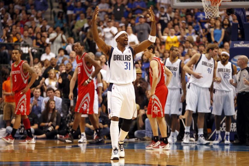 Dallas Mavericks shooting guard Jason Terry (31) reacts towards fans after getting up after...