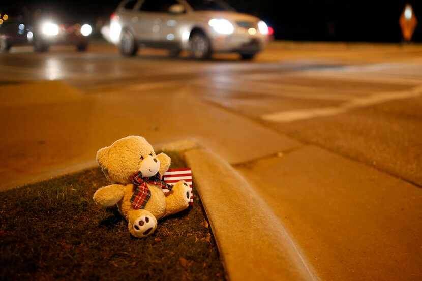 A teddy bear sat on the corner of Main and Hall of Fame in Stillwater, Okla., where earlier...