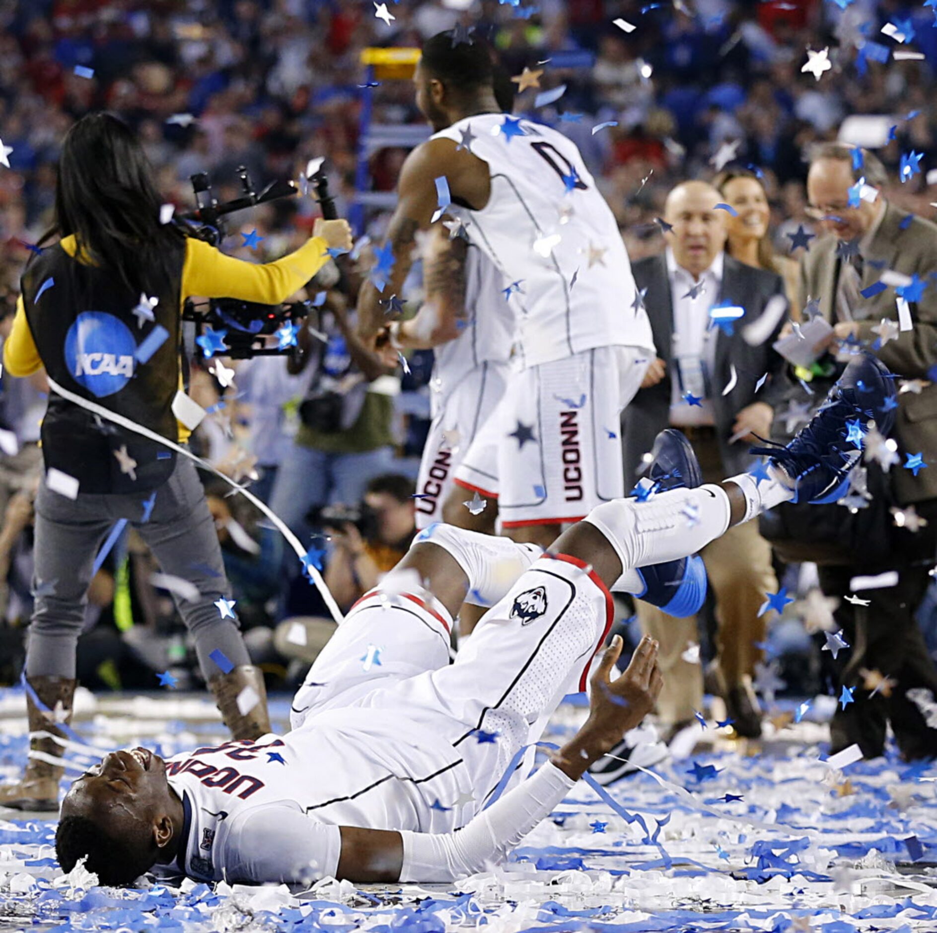 Connecticut Huskies center Amida Brimah (35) does confetti angles at center court after...