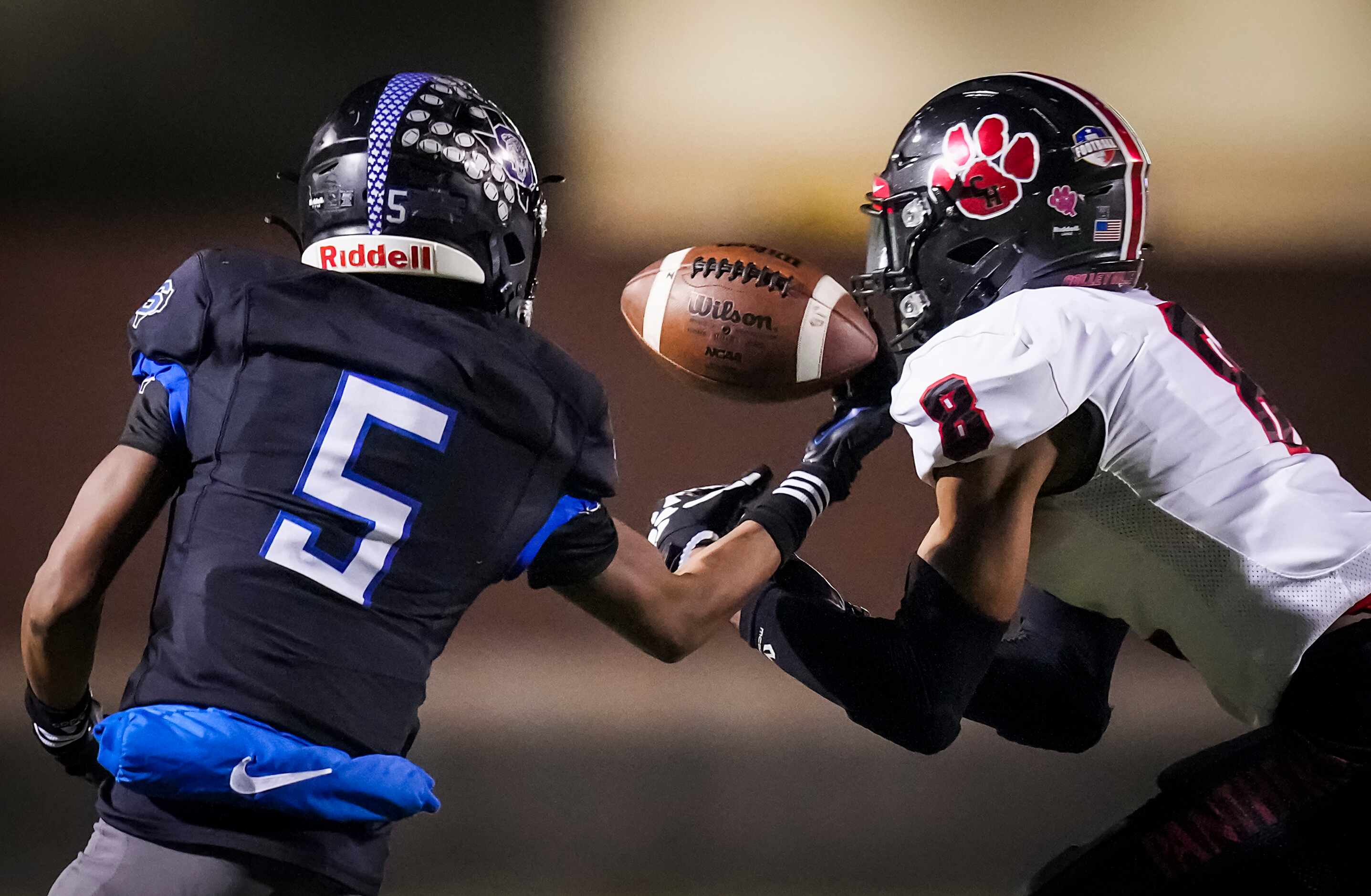 Colleyville Heritage defensive back Dylahn McKinney (8) breaks up a pass intended for...
