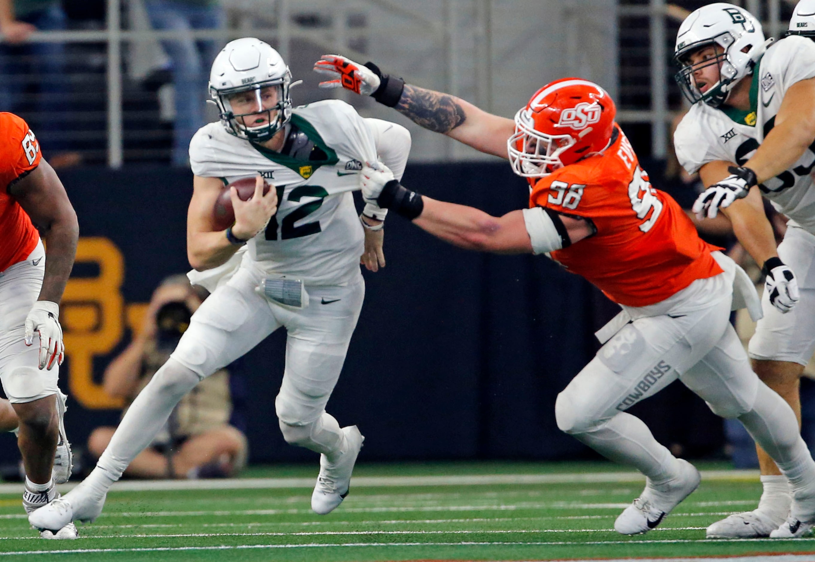 Baylor Bears quarterback Blake Shapen (12) is pressured by Oklahoma State Cowboys linebacker...