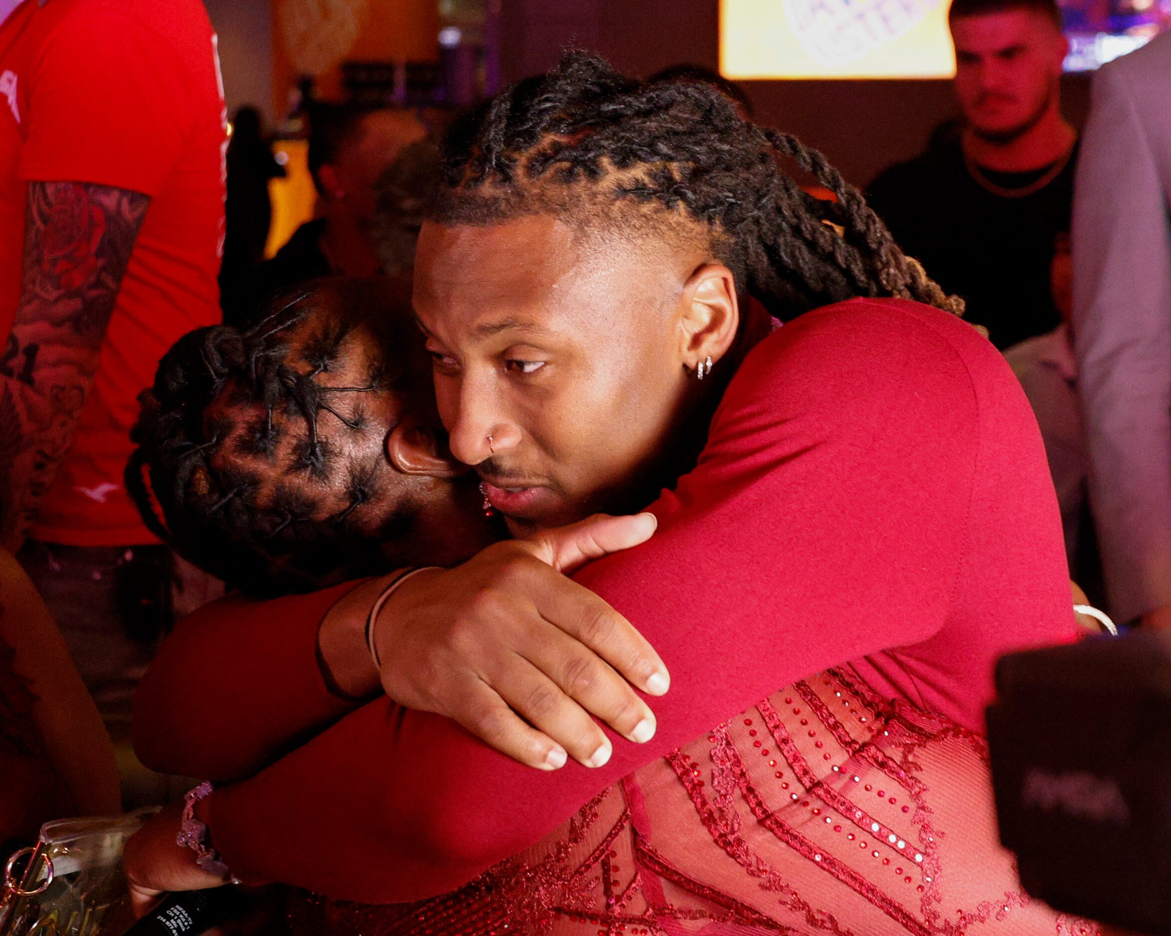 TCU wide receiver Quentin Johnston (right) hugs his mother Sherry Johnston after being...