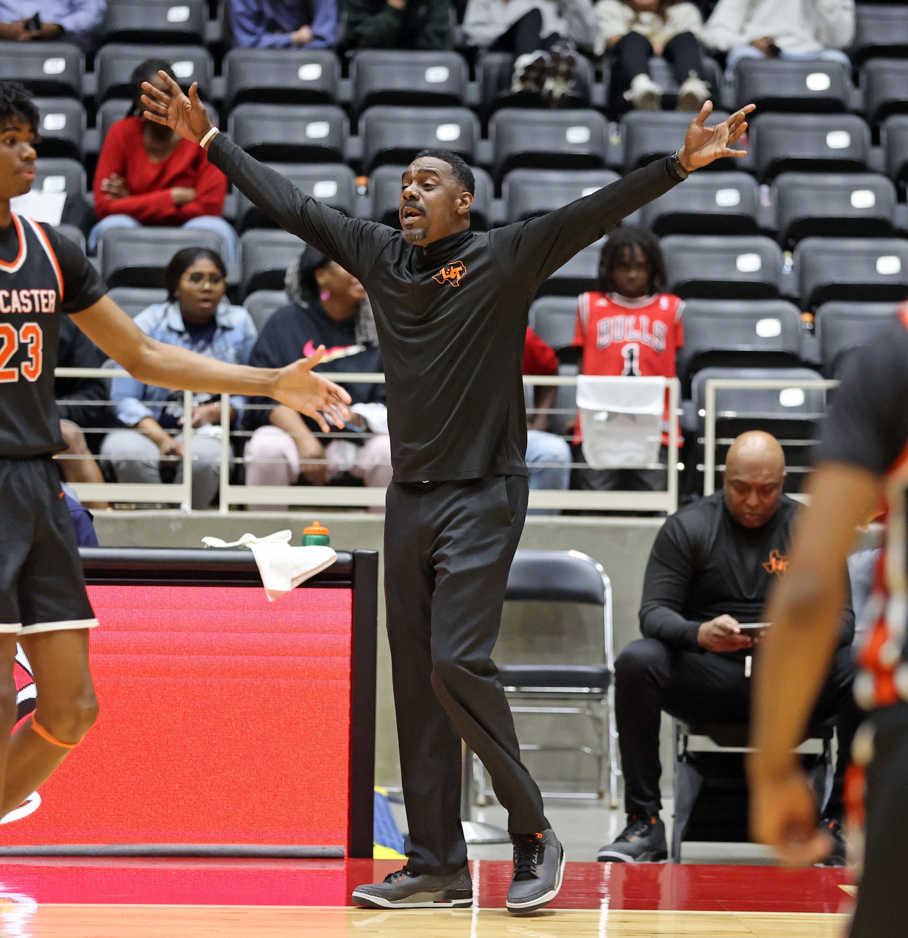 Lancaster head coach Ferrin Douglas celebrates at the and of the Class 5A Boys Region II...