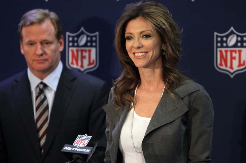NFL Commissioner Roger Goodell listens as Dallas Cowboys Executive Vice President Charlotte...