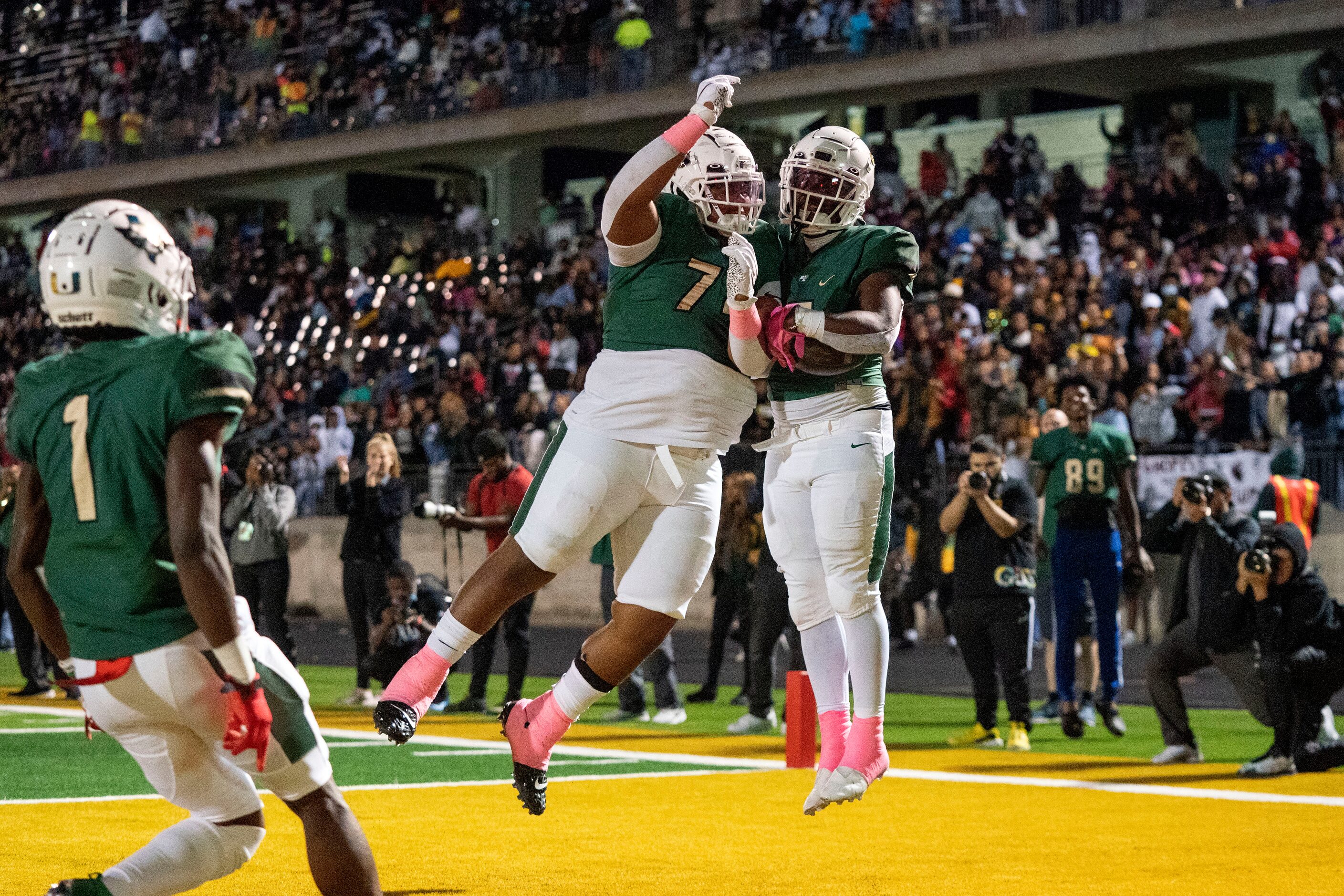 DeSoto senior offensive lineman Cam’Ron Lambert (74) celebrates with senior running back...