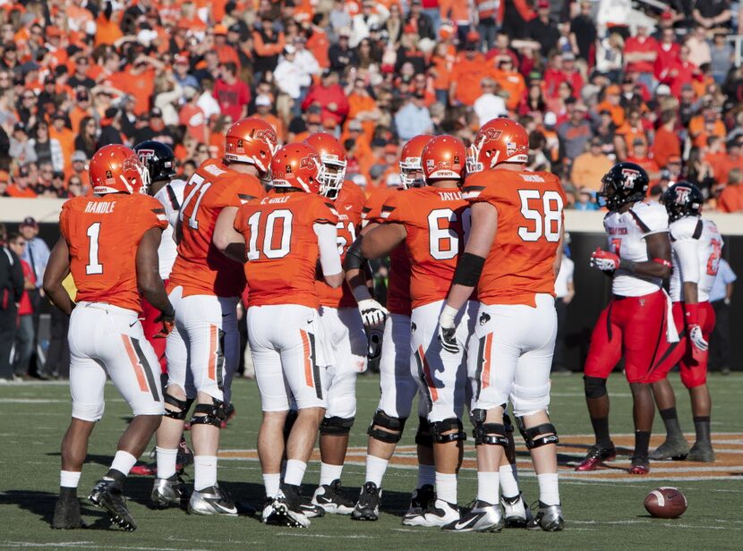 Nov 17, 2012; Stillwater OK, USA; Oklahoma State Cowboys team huddle during the first...