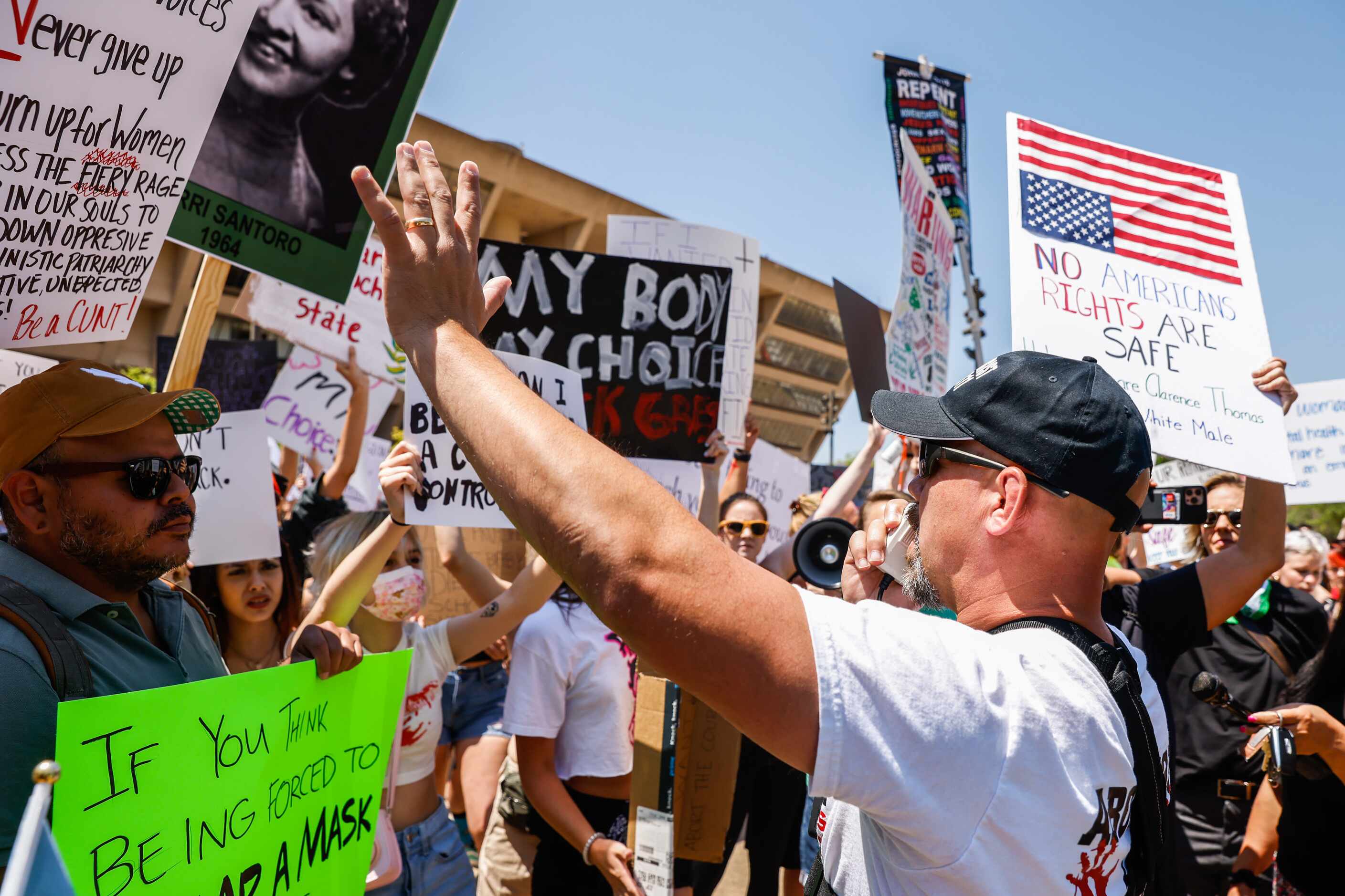 Abortion rights supporters and opponents clash while demonstrating in downtown Dallas on...