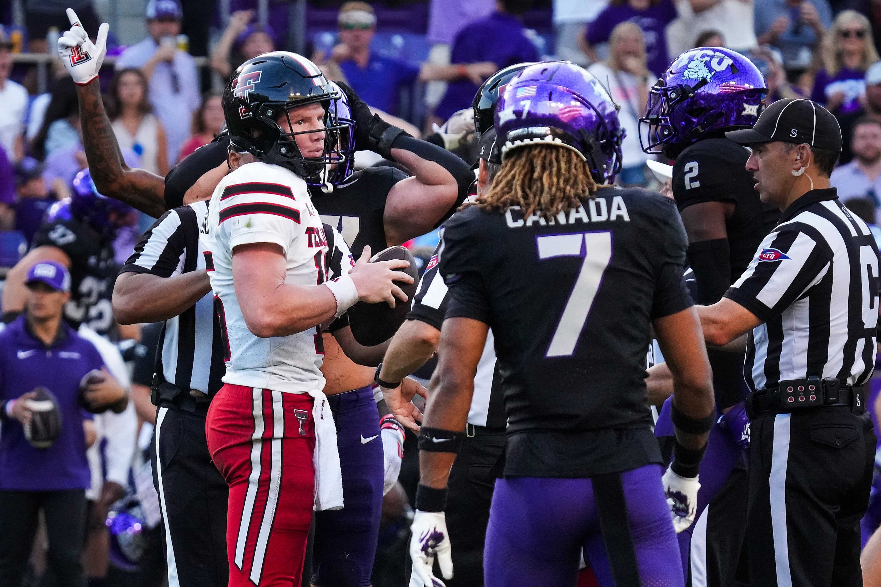 Texas Tech quarterback Will Hammond (15) reacts after turning the ball over with a fumble...