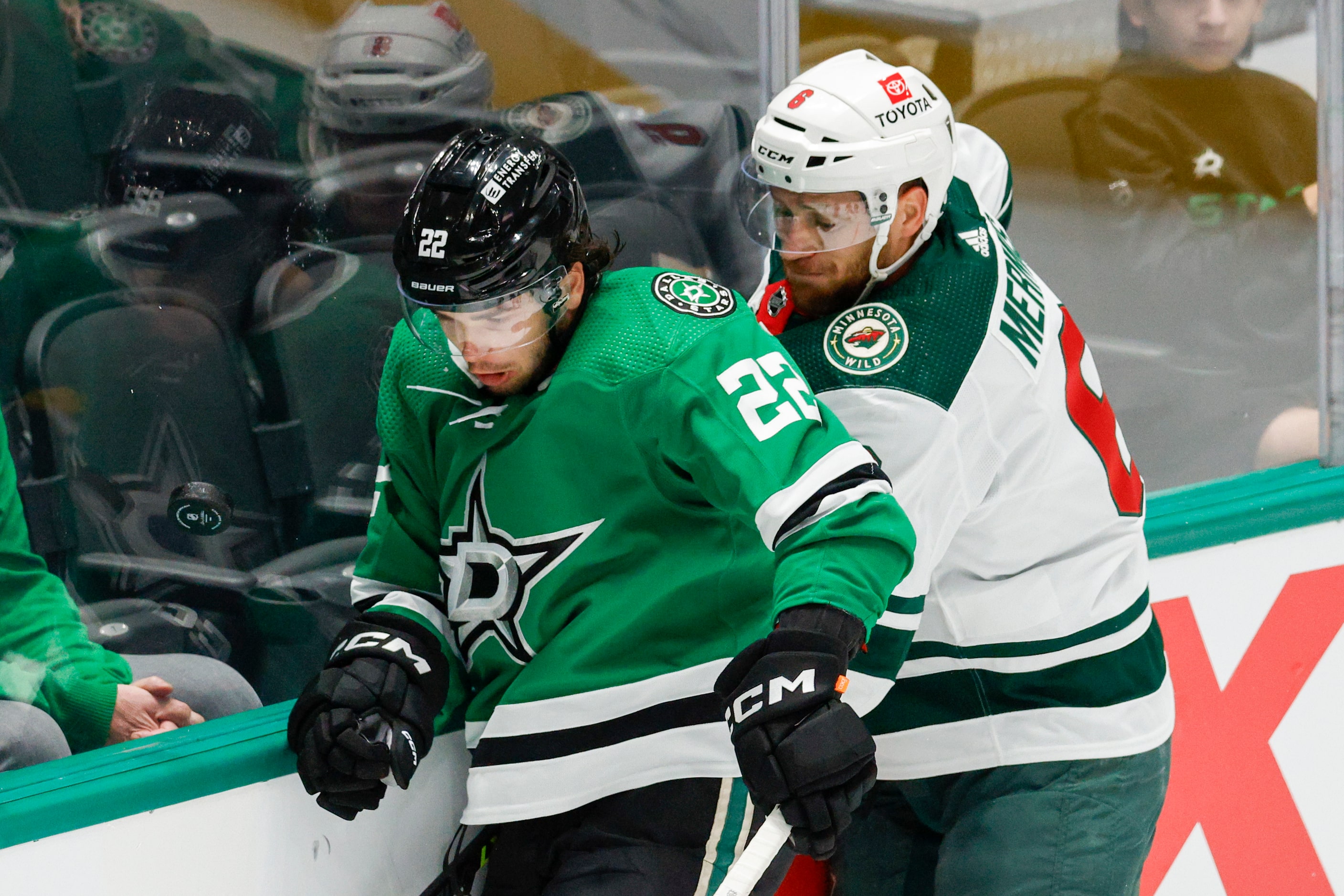 Dallas Stars center Mavrik Bourque (22) and Minnesota Wild defenseman Dakota Mermis (6)...