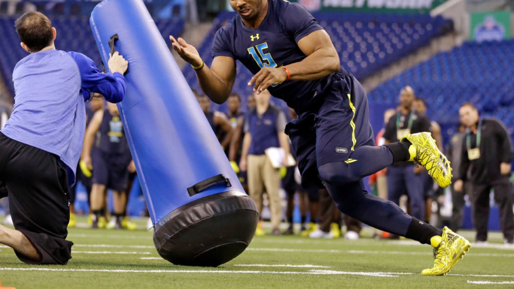 Texas A&M defensive end Myles Garrett runs a drill at the NFL football scouting combine in...
