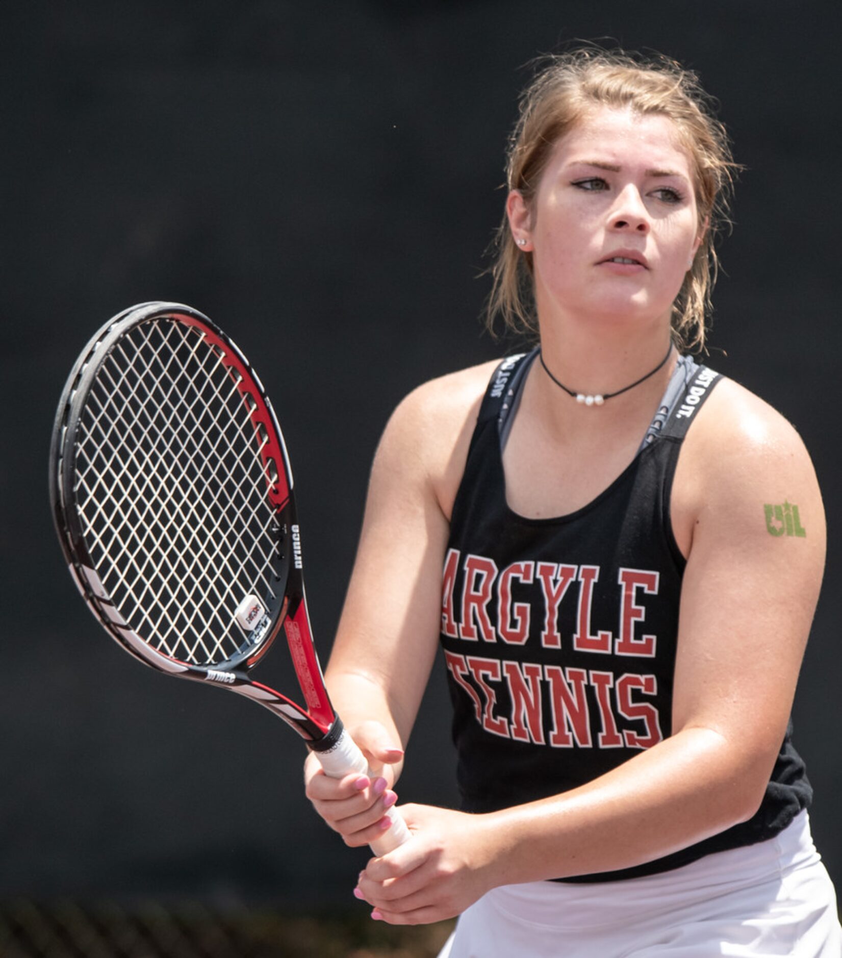 Argyle's Sarah Oellermann waits to return the ball in a doubles match with teammate Zoe...