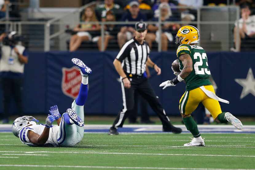 Green Bay Packers cornerback Jaire Alexander (23) intercepts a pass intended for Dallas...