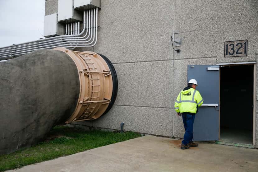 Roy Cooke opens the door to a pump station on Lavon Lake at the North Texas Municipal Water...