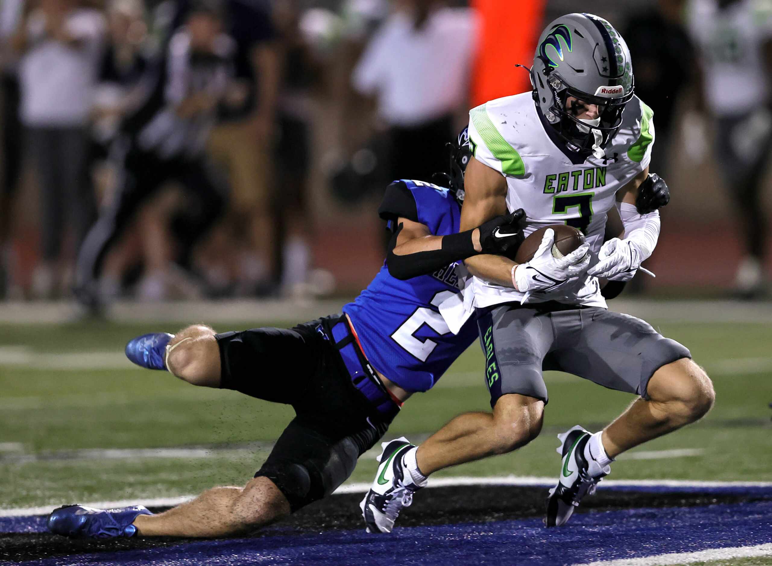 Eaton wide receiver Talan Holmes (3) comes up with a reception against Hebron (2) Connor...